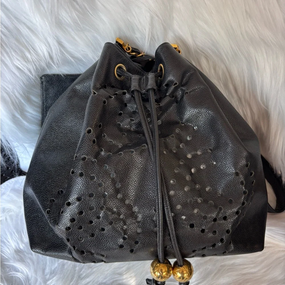 Authentic CHANEL perforated bucket black leather with pouch